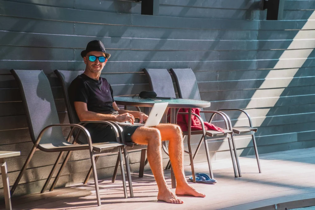 man with shades working remotely