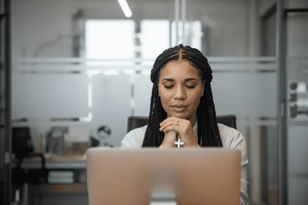 lovely woman praying over her posting schedule